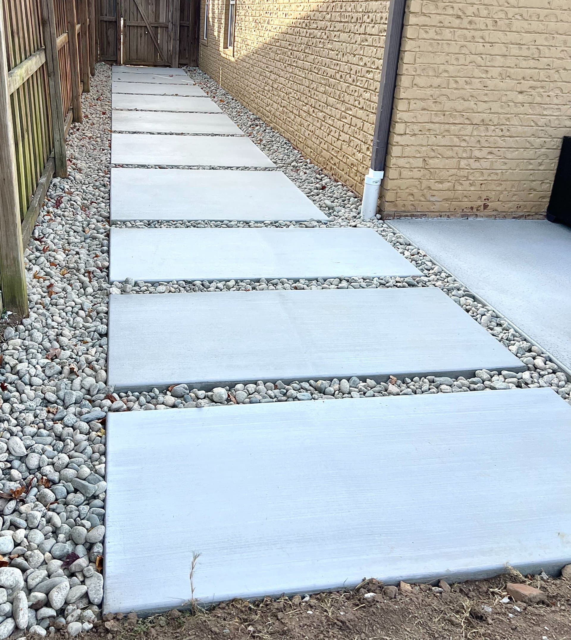 Broom finish concrete walkway with slip-resistant texture in Northwest Arkansas